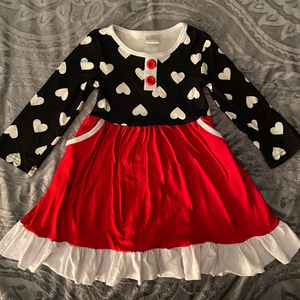 Long sleeved Heart dress with pockets.